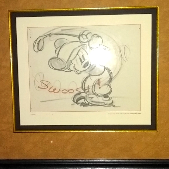 MICKEY CUT A DAPPER FIGURE AS HE DRIVES GOLF BALL